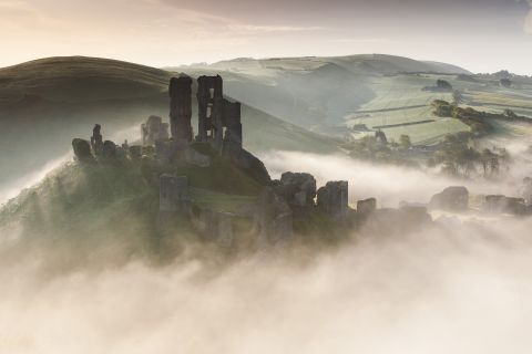 Corfe castle rising from the mist